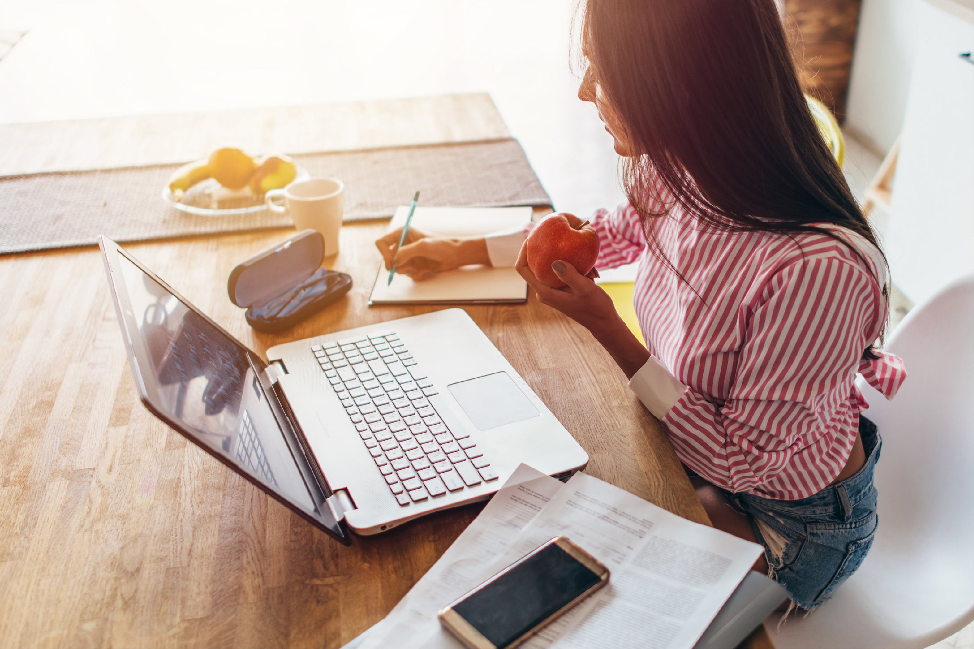 Woman working from kitchen table